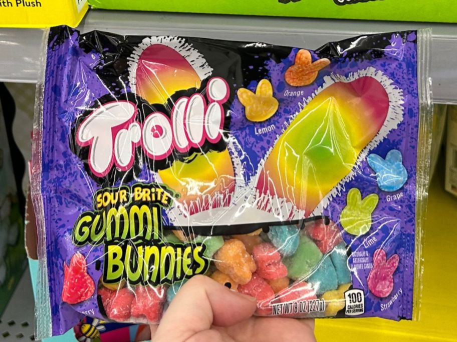 Hand holding a bag of Trolli Gummy Bunnies