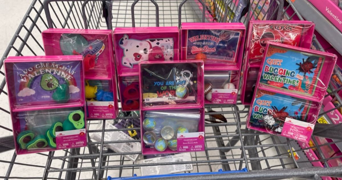 boxes of Valentine Treat packs in cart at Walmart