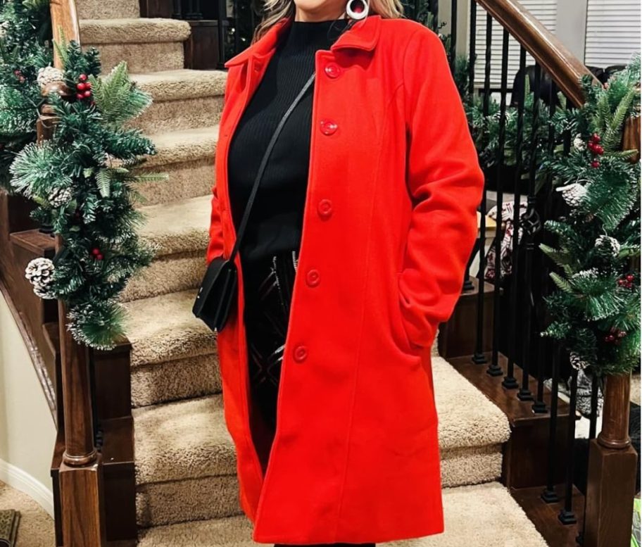 Woman wearing a bright red trench coat