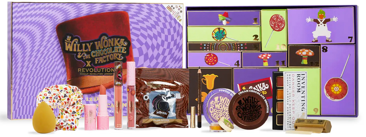 purple wonka advent calendar with makeup products in front of it