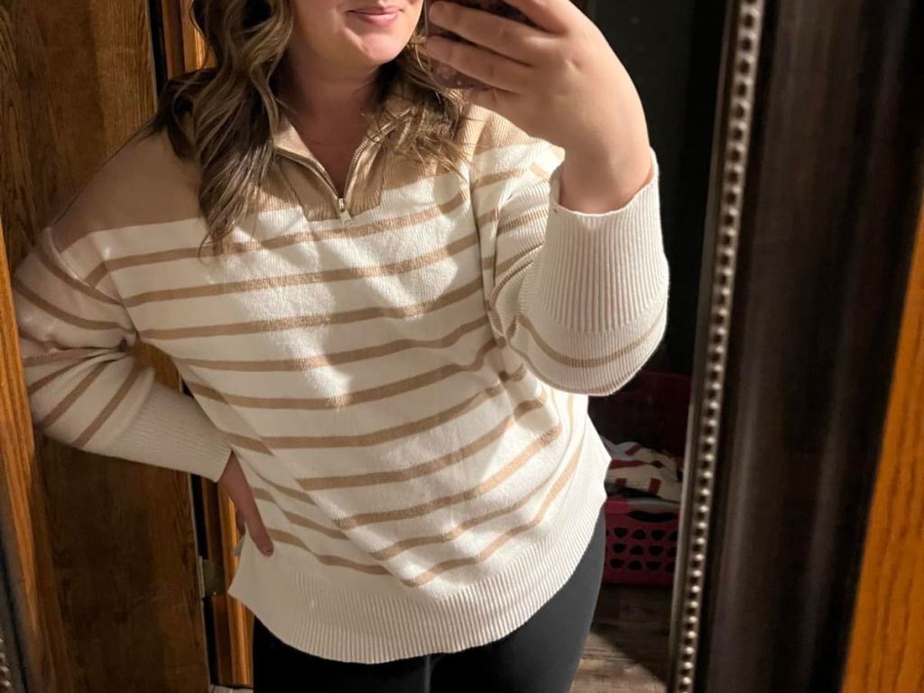 A woman wearing a ZESICA Women's Ribbed Striped Half-Zip Sweater