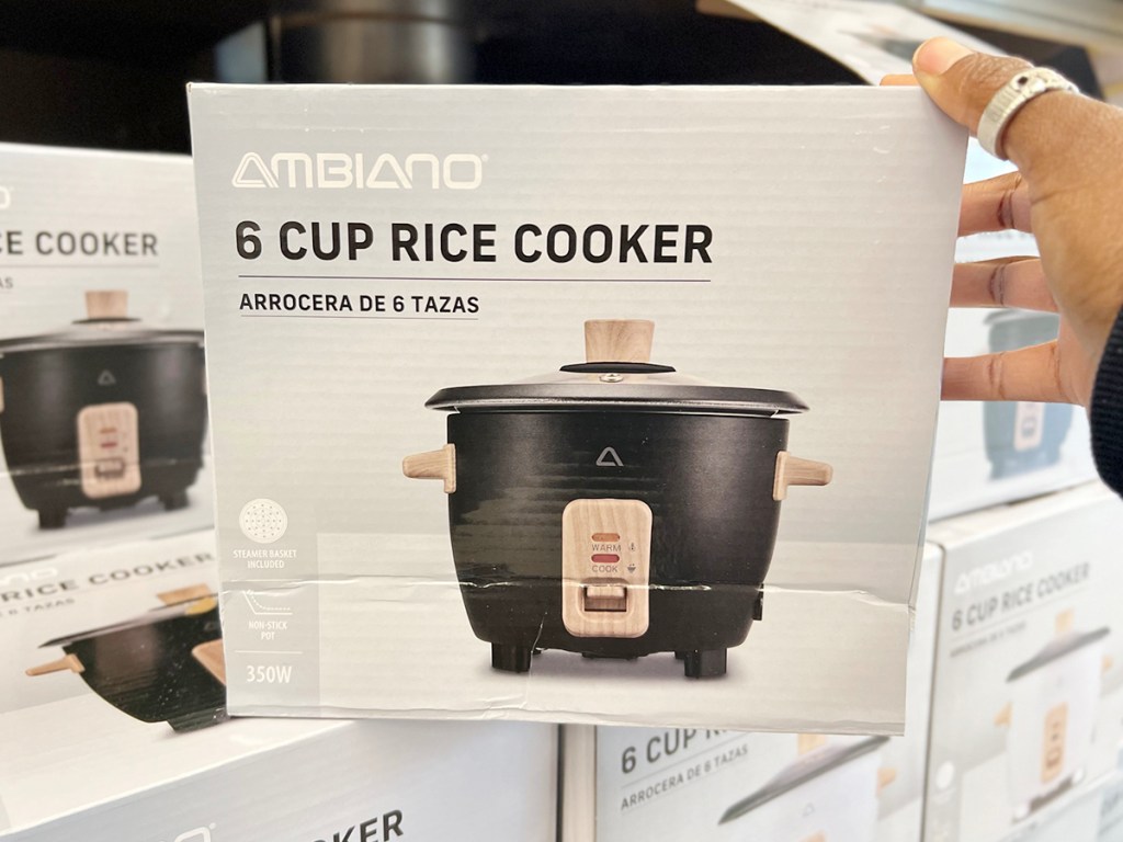 hand reaching for ambiano rice cooker on shelf in aldi store