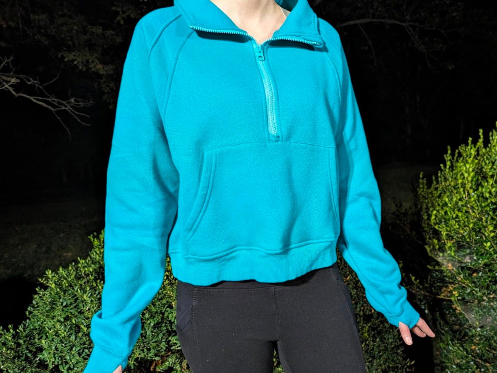 woman wearing blue cropped sweatshirt