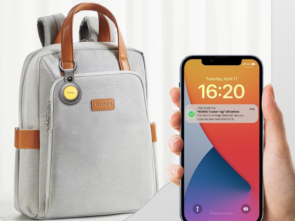 backpack with a momax attached to it in yellow and a hand holding a cellphone with a pop up message