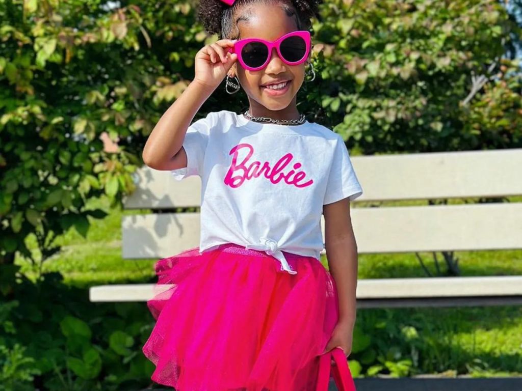 Little girls wearing a 2-piece Barbie outfit