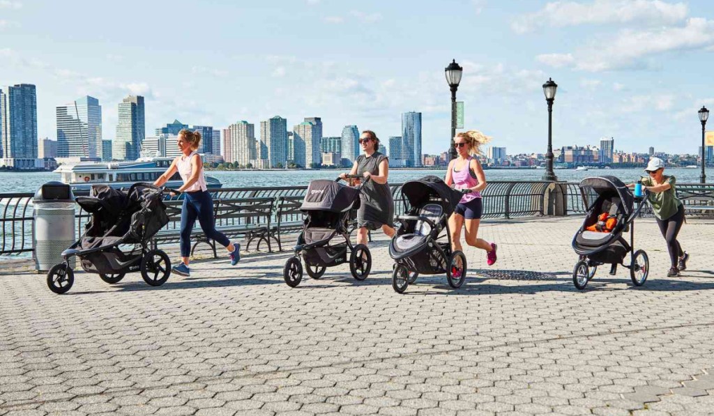 many women running with variety of jogging strollers