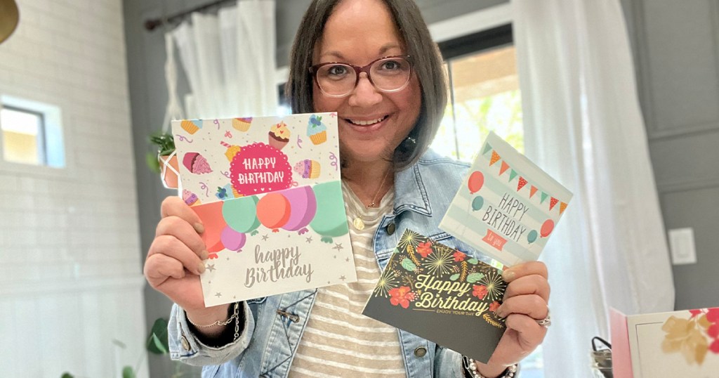 woman holding birthday cards