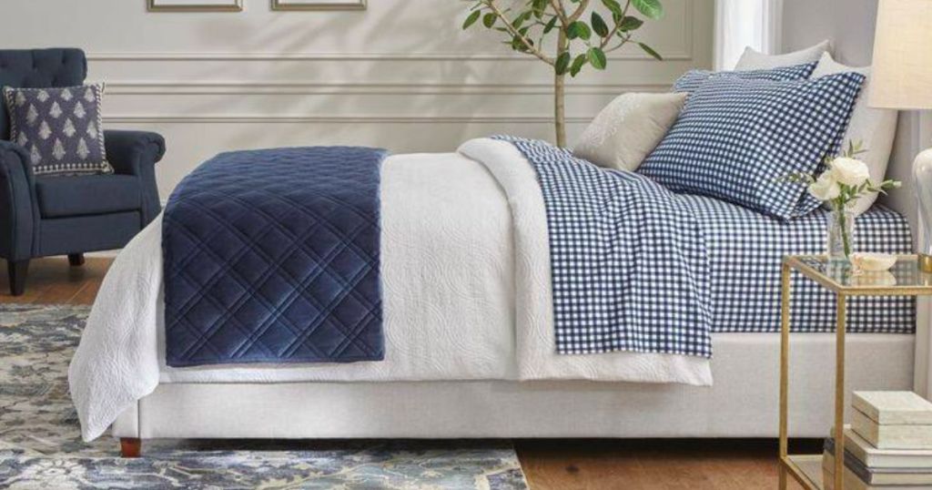 blue gingham flannel sheets on a bed with a white duvet