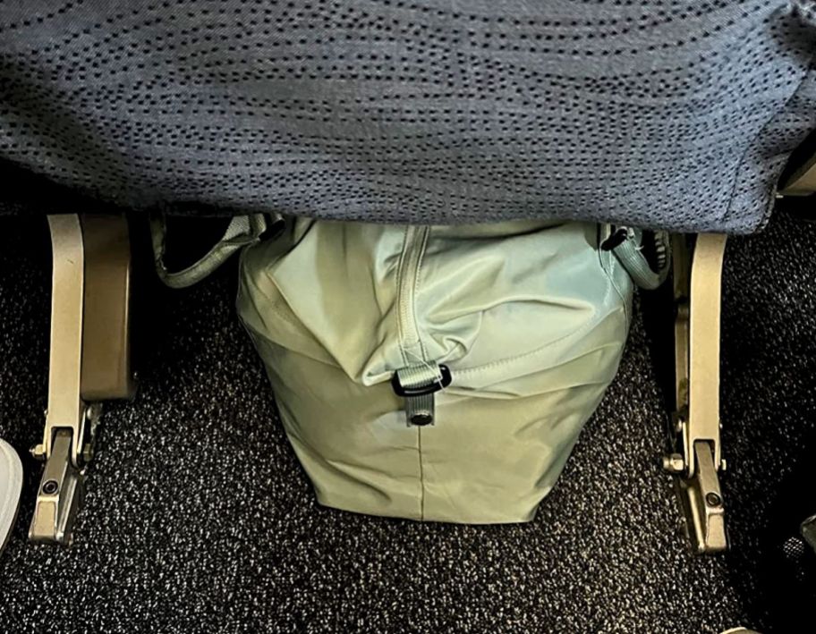 carry on bag stowed under airplane seat