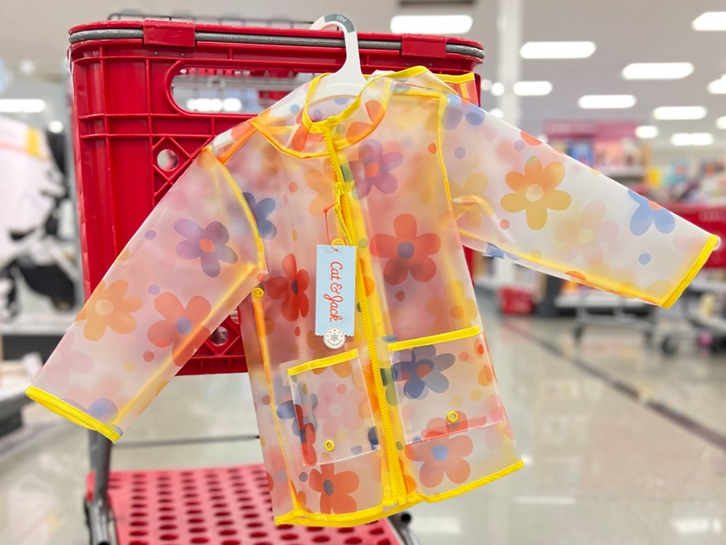 yellow and flower kids raincoat hanging on target shopping cart