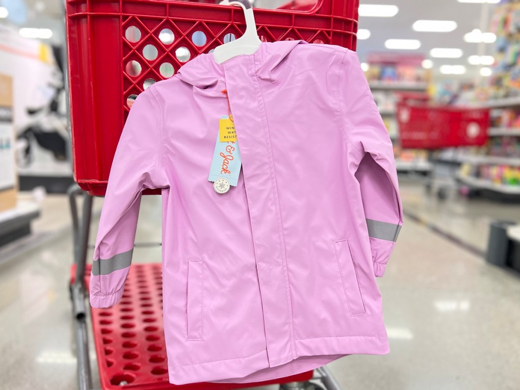 purple kids raincoat hanging on target shopping cart