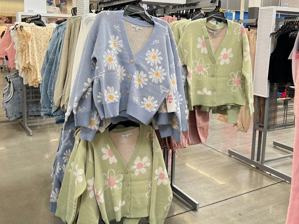 blue and green floral cardigans hanging in walmart