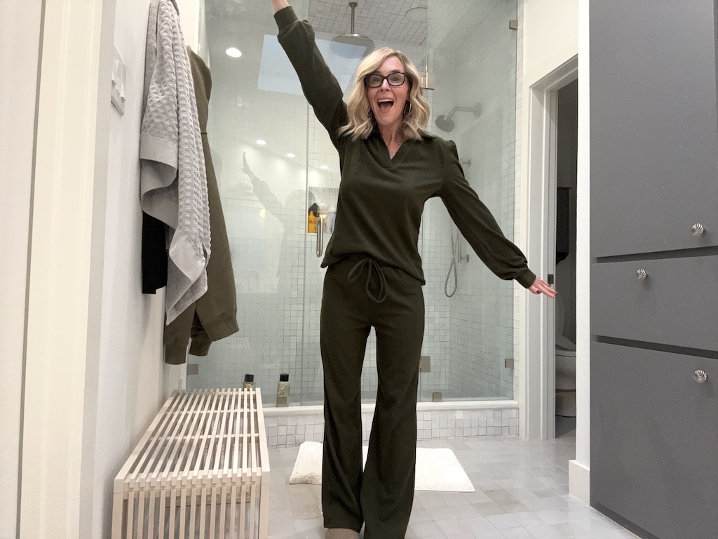 woman wearing green lounge set in bathroom 