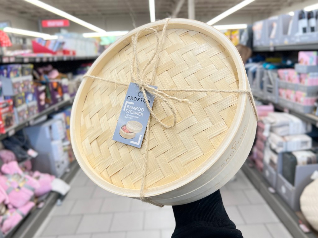 hand holding bamboo steamer in aldi store
