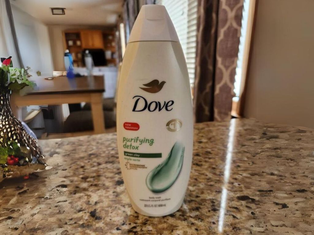 bottle of dove detox body wash on table