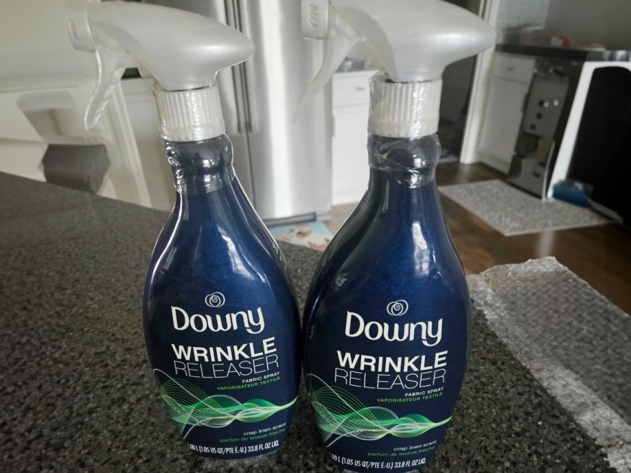 two downy wrinkle releasers on table