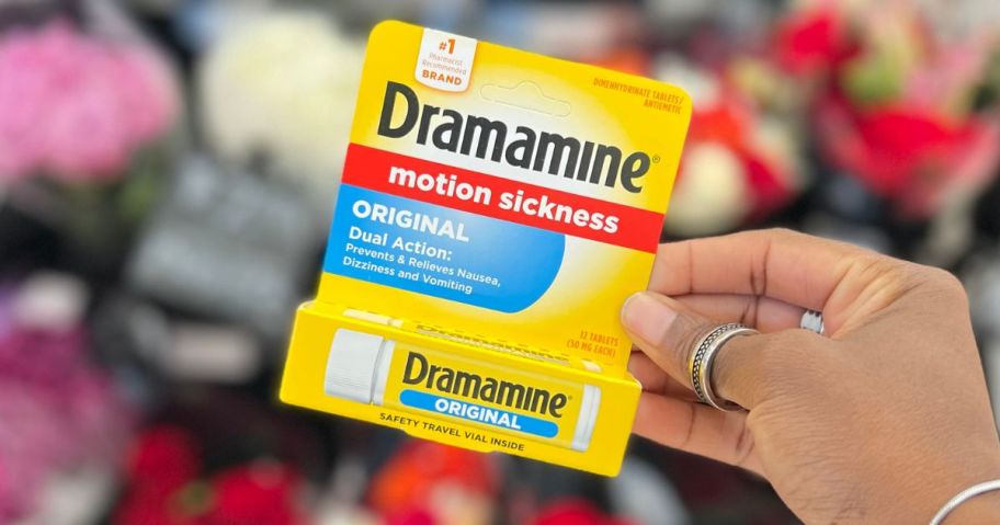 Dramamine Motion Sickness Relief Less Drowsey Formula being held in aisle in store