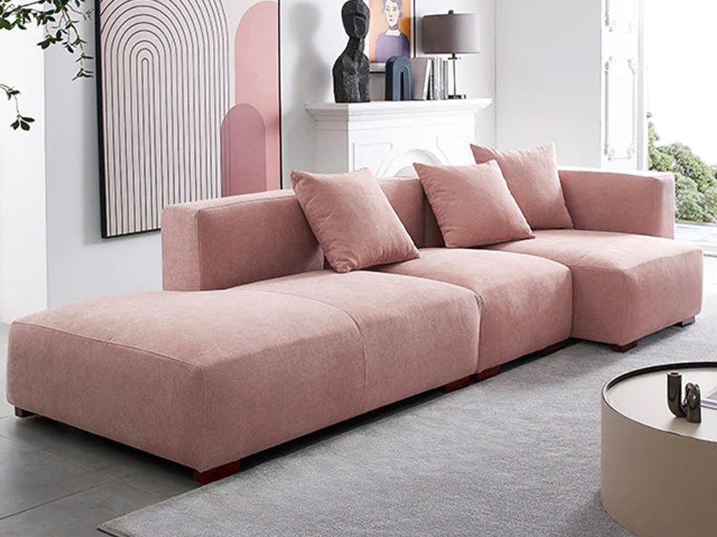 l shaped pink sofa in living room