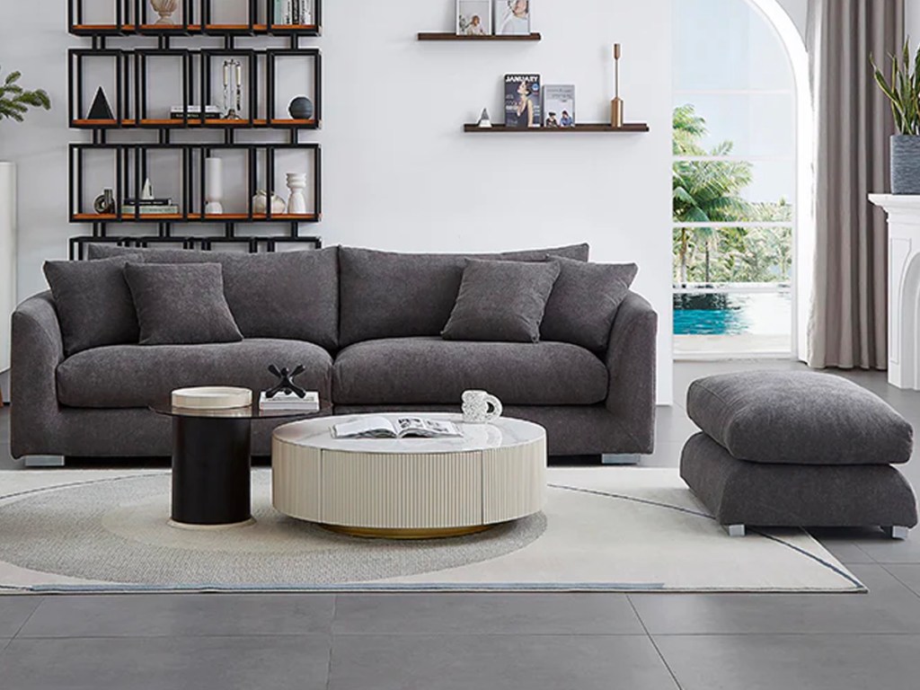dark grey sofa with ottoman in living room