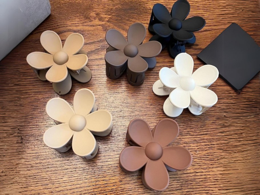 different neutral color flower claw clips laying on a table