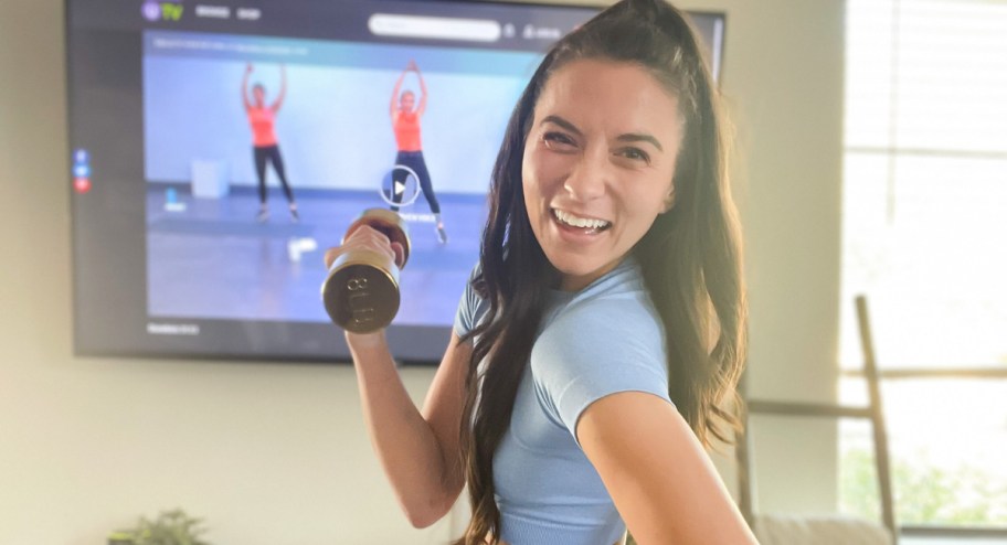 girl using Healthy U TV Program to workout with weight in hand