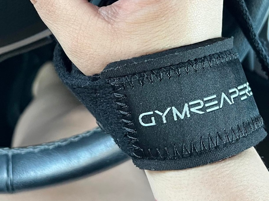 wearing a black Gymreaper wristband