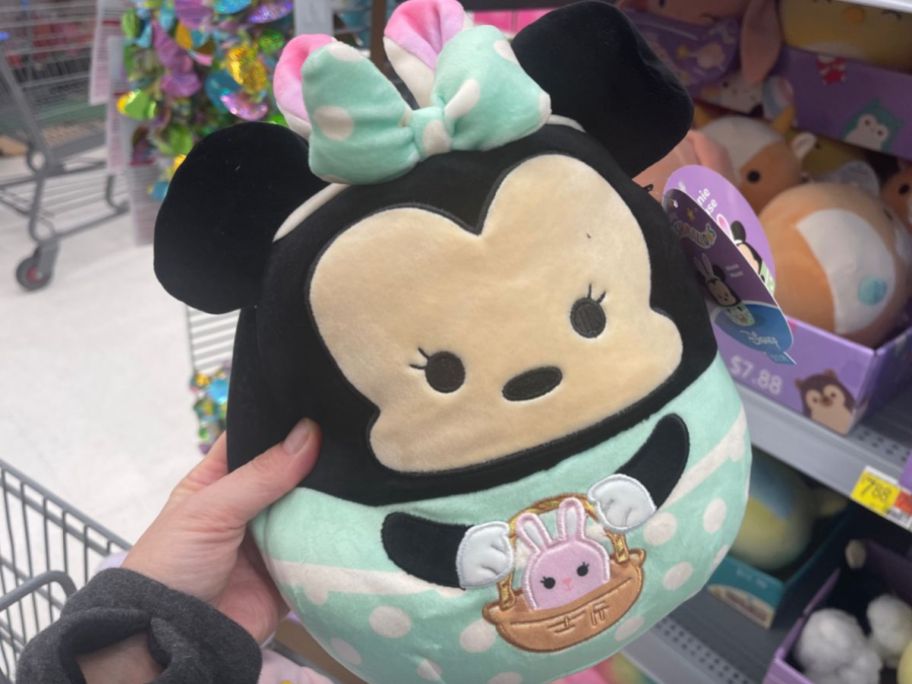hand holding Minnie Mouse squishmallows in store