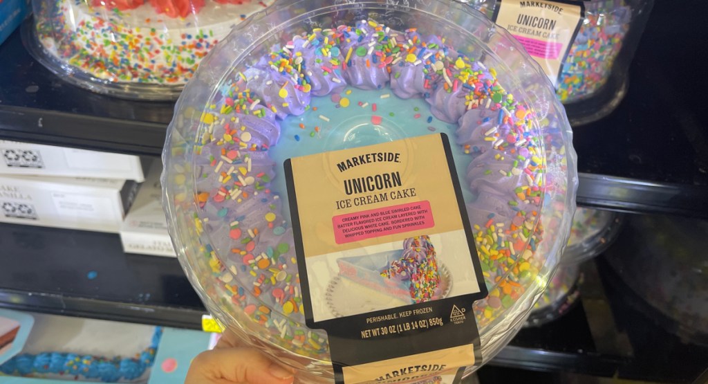 hand holding a unicorn ice cream cake from Walmart