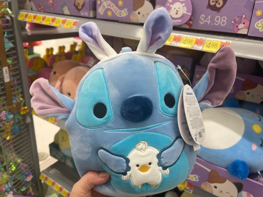 hand holdingSquishmallows 8 Stitch w Bunny Ears s in store