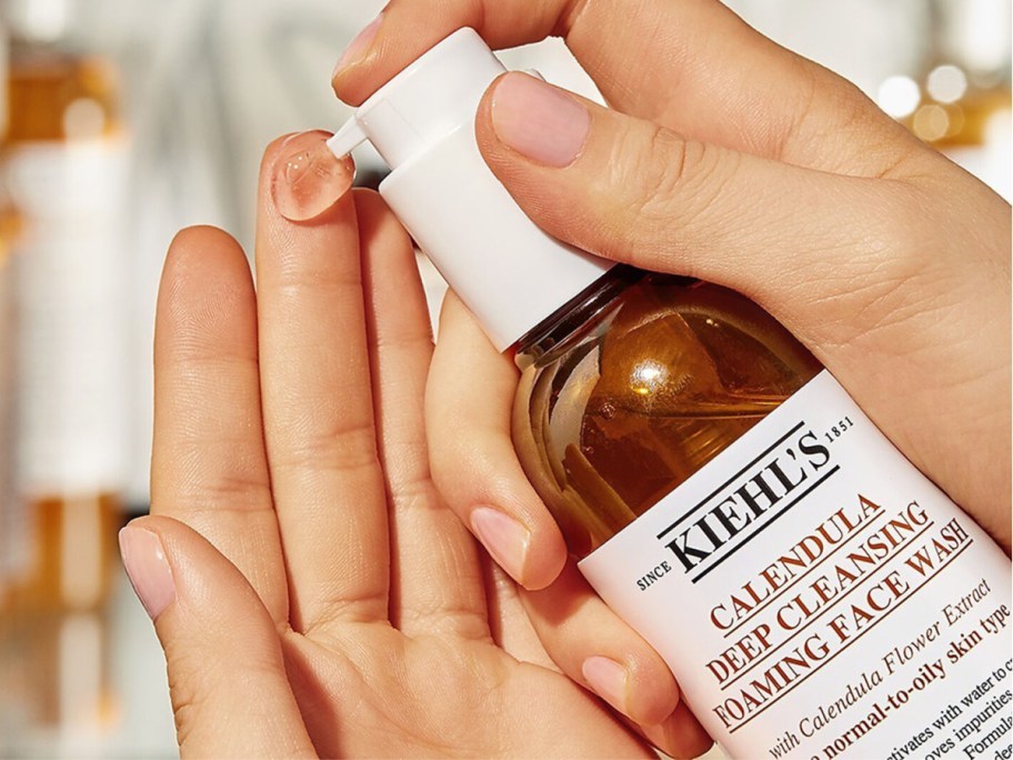 hand pouring Kiehl's since 1851 Calendula Deep Cleansing Foaming Face Wash