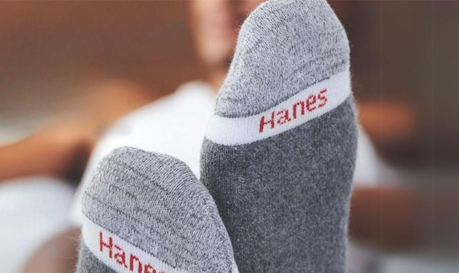 a person's feet shown in a pair of hanes cushion comfort socks
