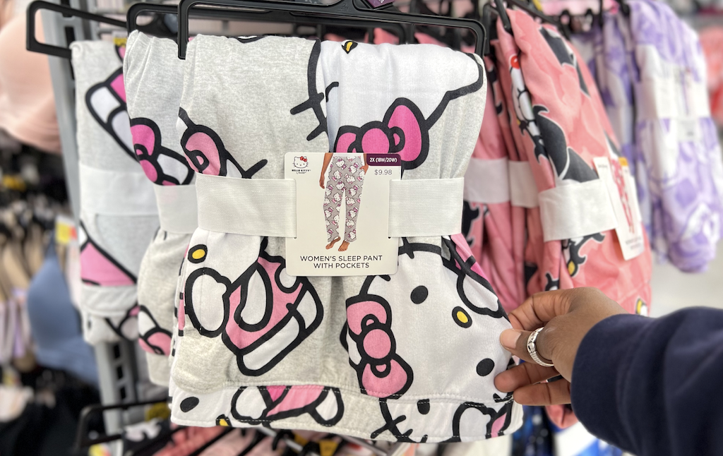 woman holding Hello Kitty pajama pants 