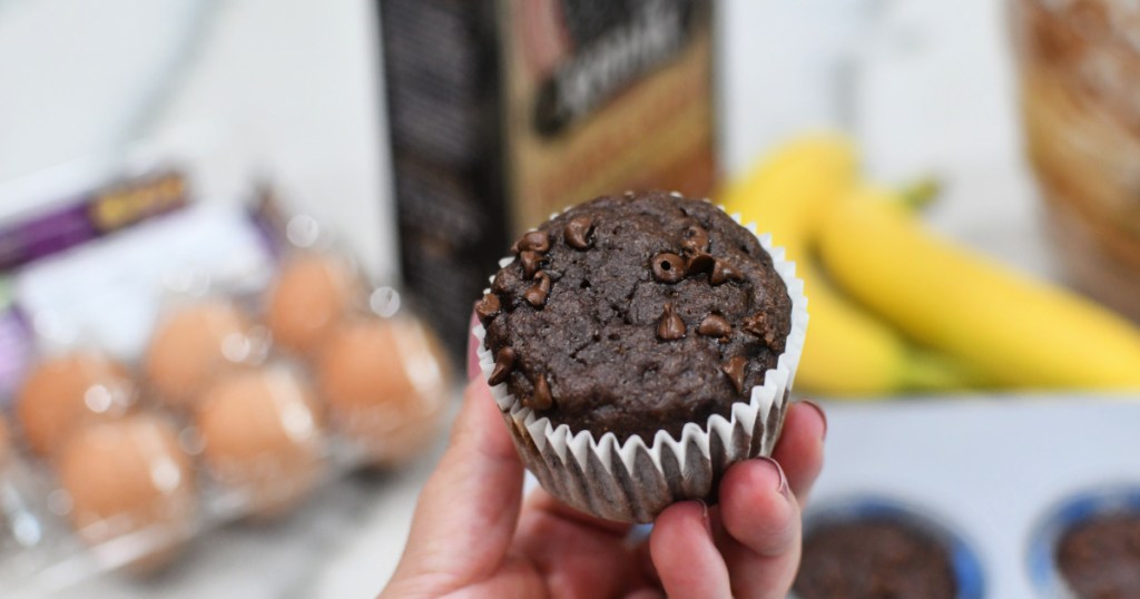 holding a chocolate muffin
