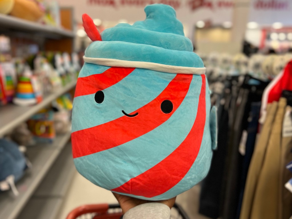 hand holding blue and red icee squishmallow