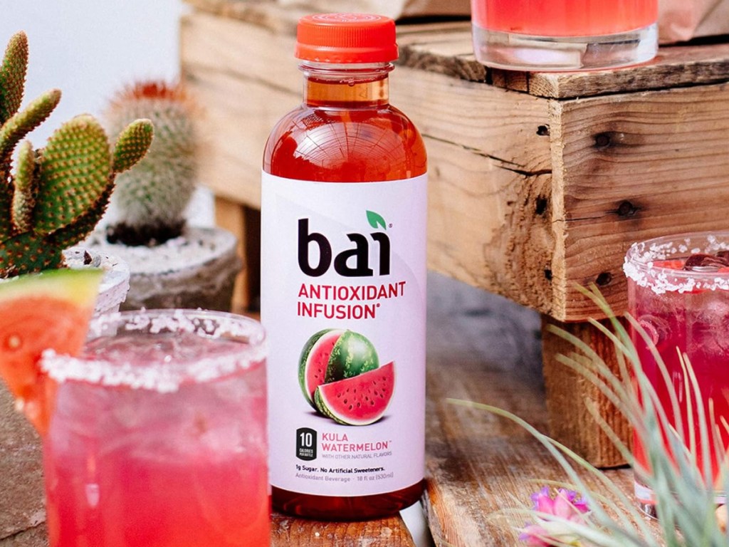 image of Bai Kula Watermelon Infused Flavored Water 18oz Bottles 12-Pack surrounded by cups with the drink in it