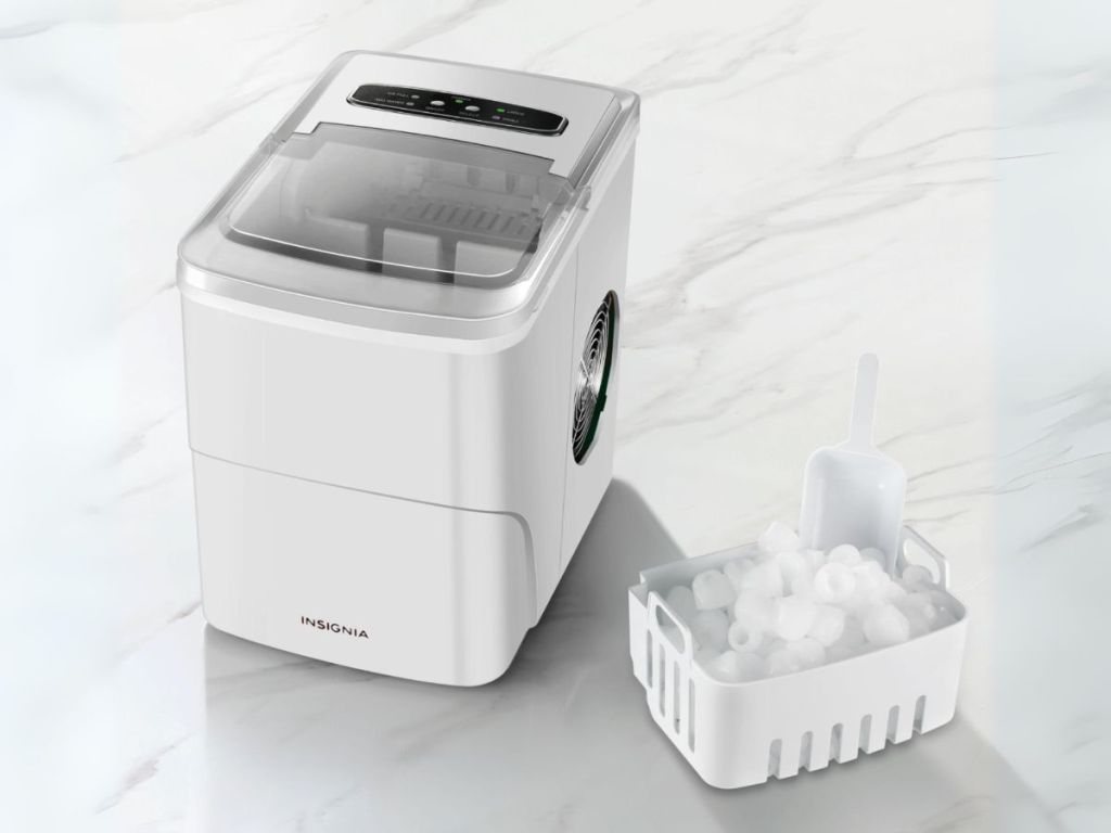 ice maker sitting next to ice tray