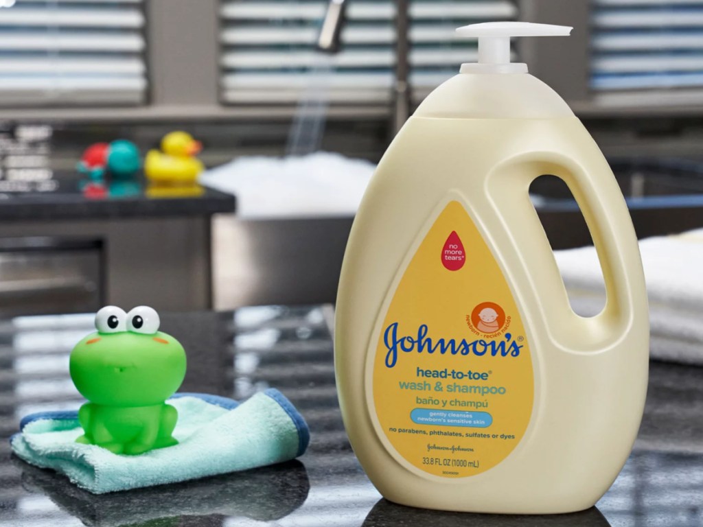 big bottle of johnson's baby wash next to a frog bath toy