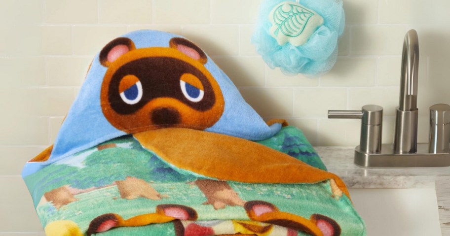 kids hooded towel and loofah with Animal Crossing character sitting on a sink