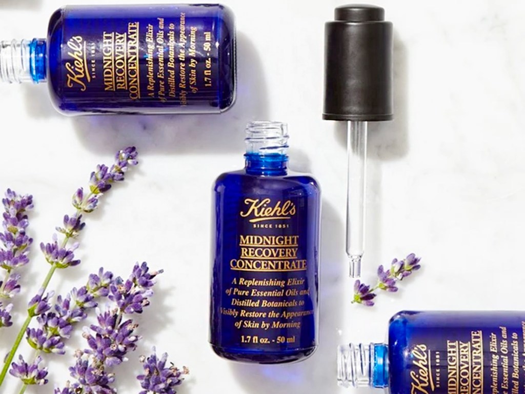 kiehls 1851 midnight recovery face oil bottles with lavendar