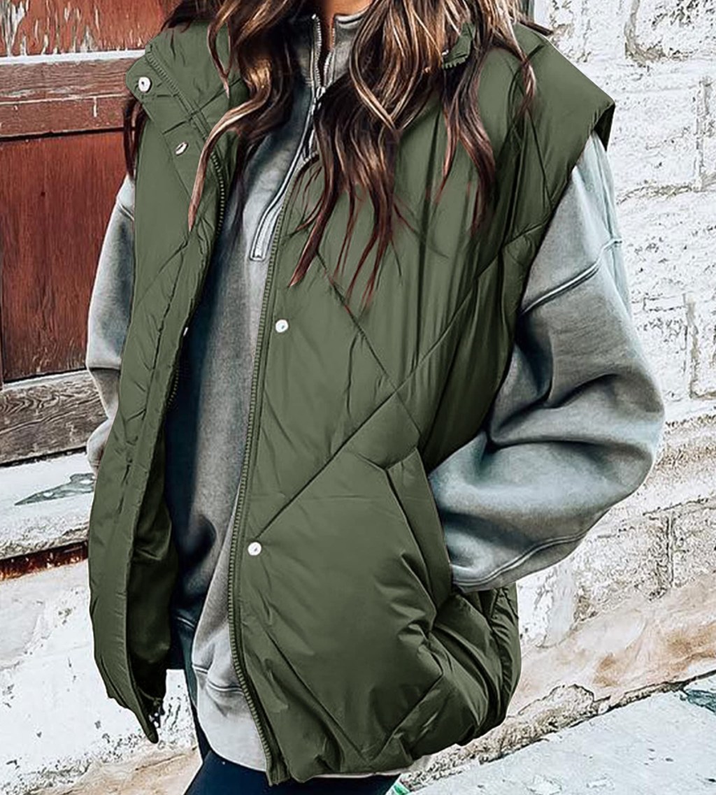 woman wearing a green puffer vest