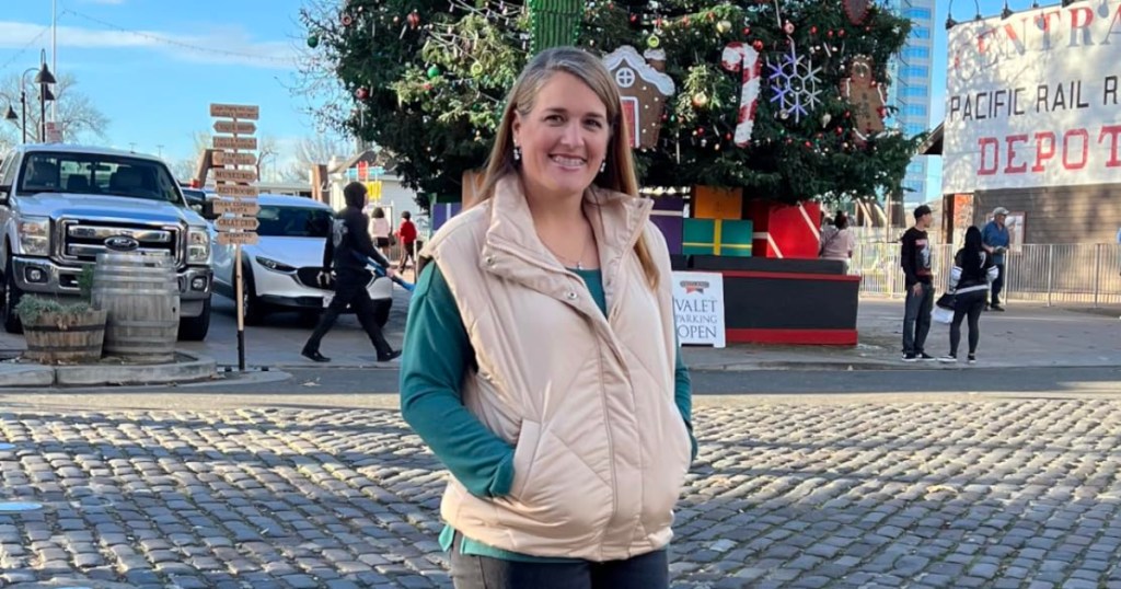 woman wearing white puffer vest