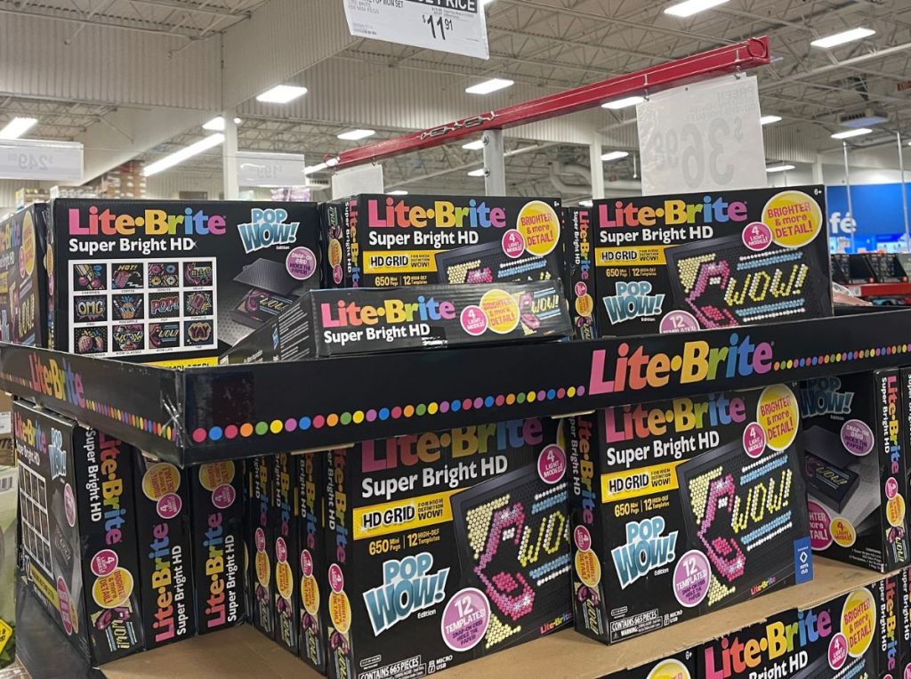 lite brite pop wow sets stacked on a store shelf