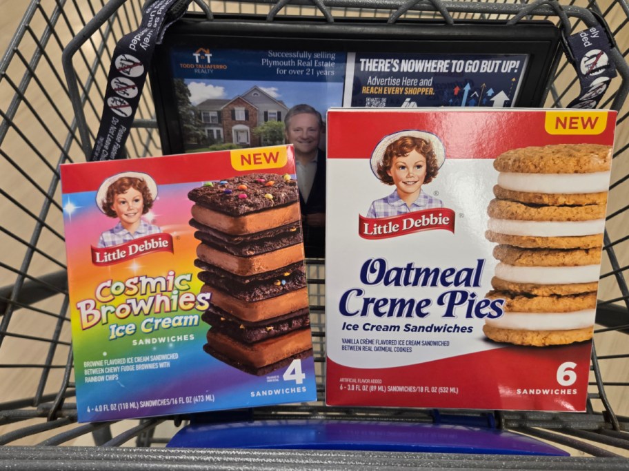 Boxes of Little Debbie ice cream sandwiches in a shopping cart: Cosmic Brownies on the left and Oatmeal Creme Pies on the right. Both are labeled "New."
