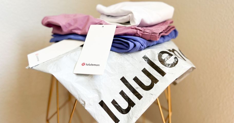 lululemon delivery bag with clothing on top of it