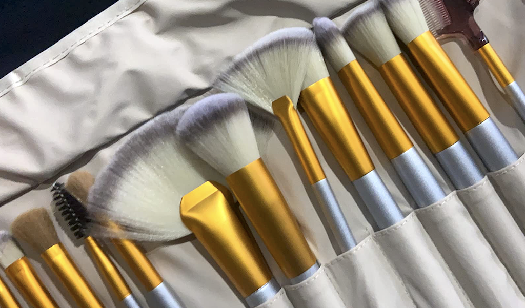 makeup brush set with gold accents 