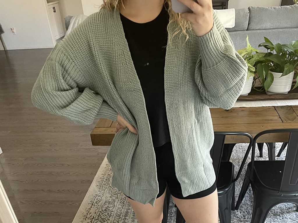 woman taking selfie in dining room