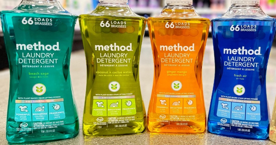 4 bottles of Method Laundry Detergent sitting on a store floor