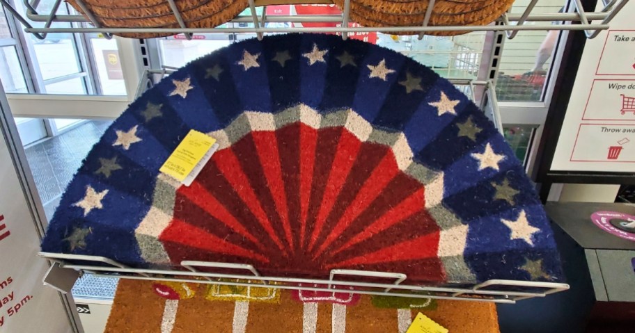 red, white and blue fan style American Flag coir doormat on display shelf