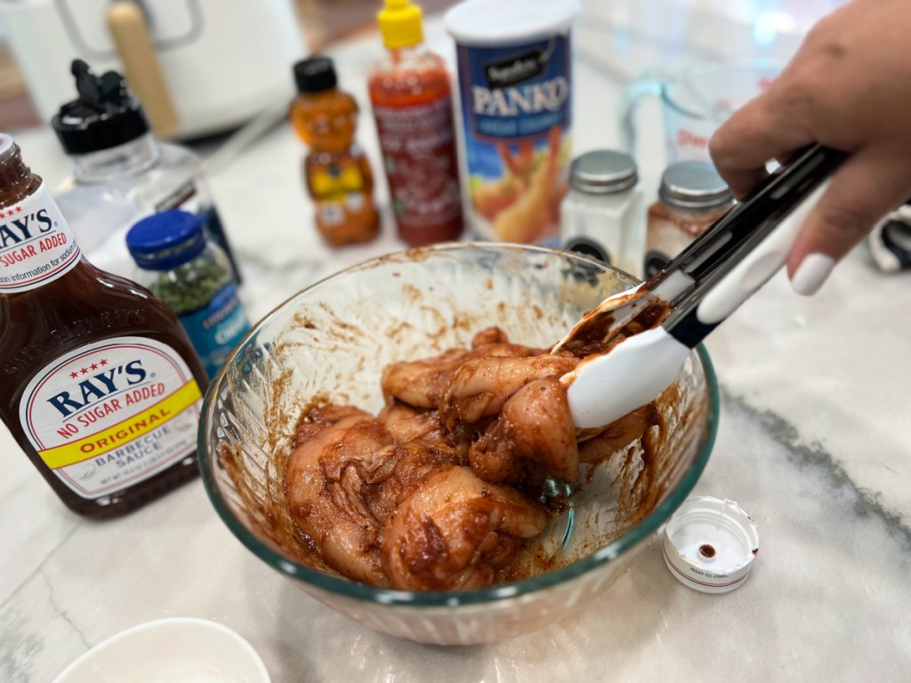 mixing chicken with bbq sauce