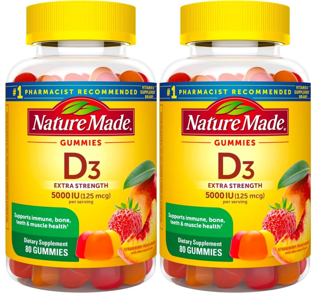 2 bottles of nature made d3 on white background stock image